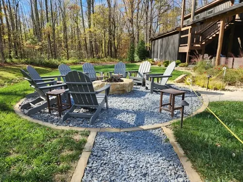 Custom stone fire pit and built-in seating zone in Murray, UT